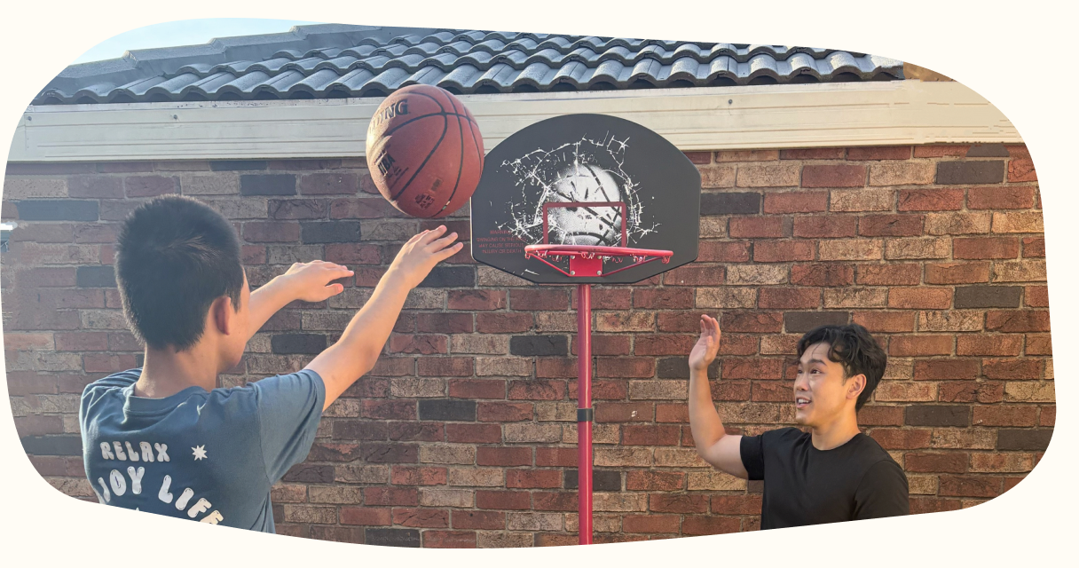 A participant practising basketball during a play-based session